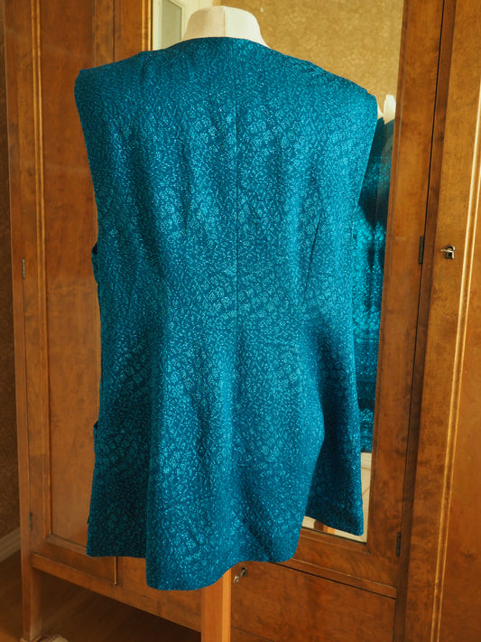 Turkoosi kimalteleva liivi