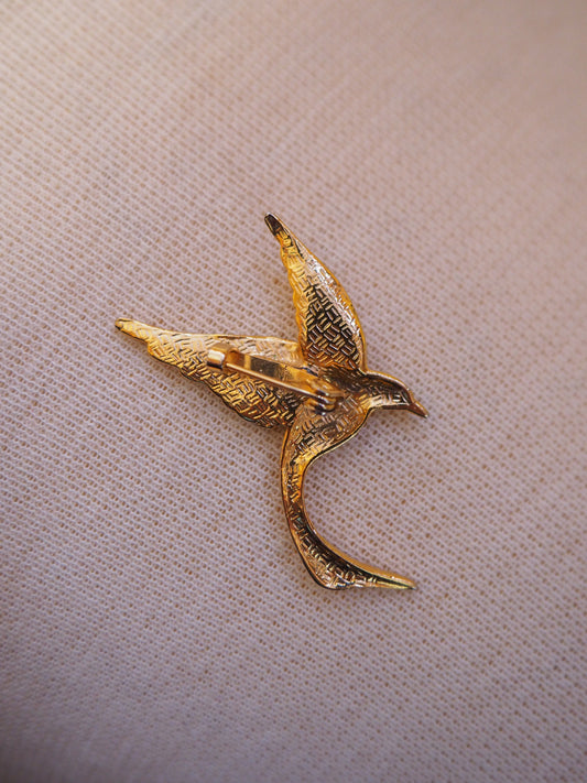 Kullansävyinen lintu rintaneula