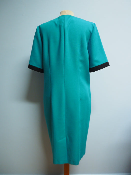 Turkoosi Carolin Muoti-Hovin mekko