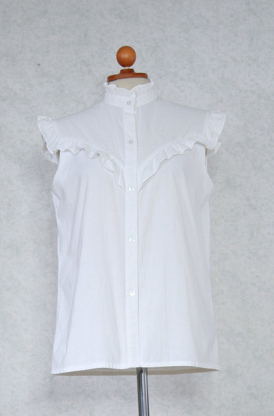 Valkoinen röyhelöinen hihaton S-Style paita
