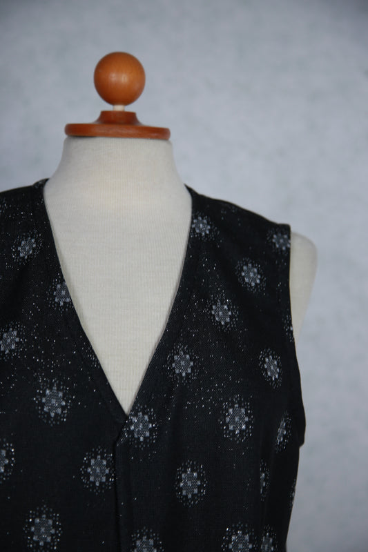 Tummanharmaa kuviollinen kimalteleva liivi